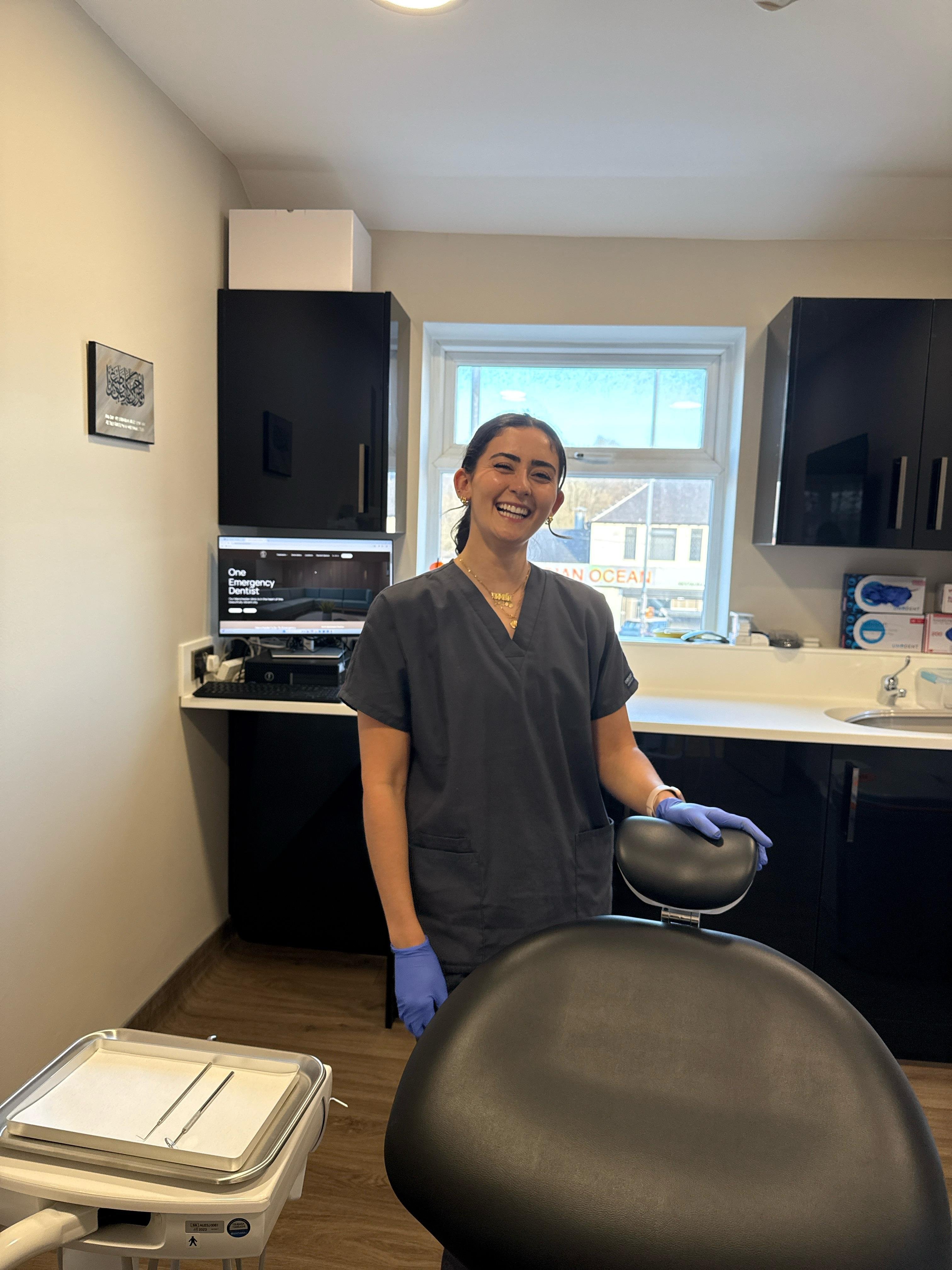 emergency dentist Birmingham performing tooth extraction